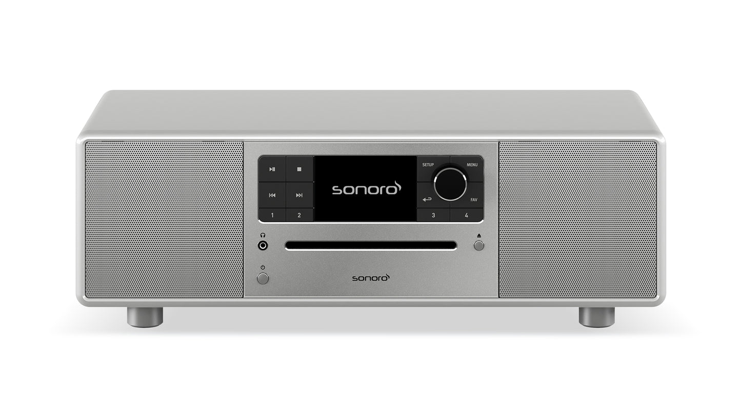 Das Sonoro Prestige in hochglänzendem Silber bietet exzellente Akustik durch zwei Lautsprecher pro Seite, zentrales Display, Bedientasten, große Lautstärkeregler und CD-Slot-ideal für vielfältige Musikquellen auf vier kurzen Beinen.
