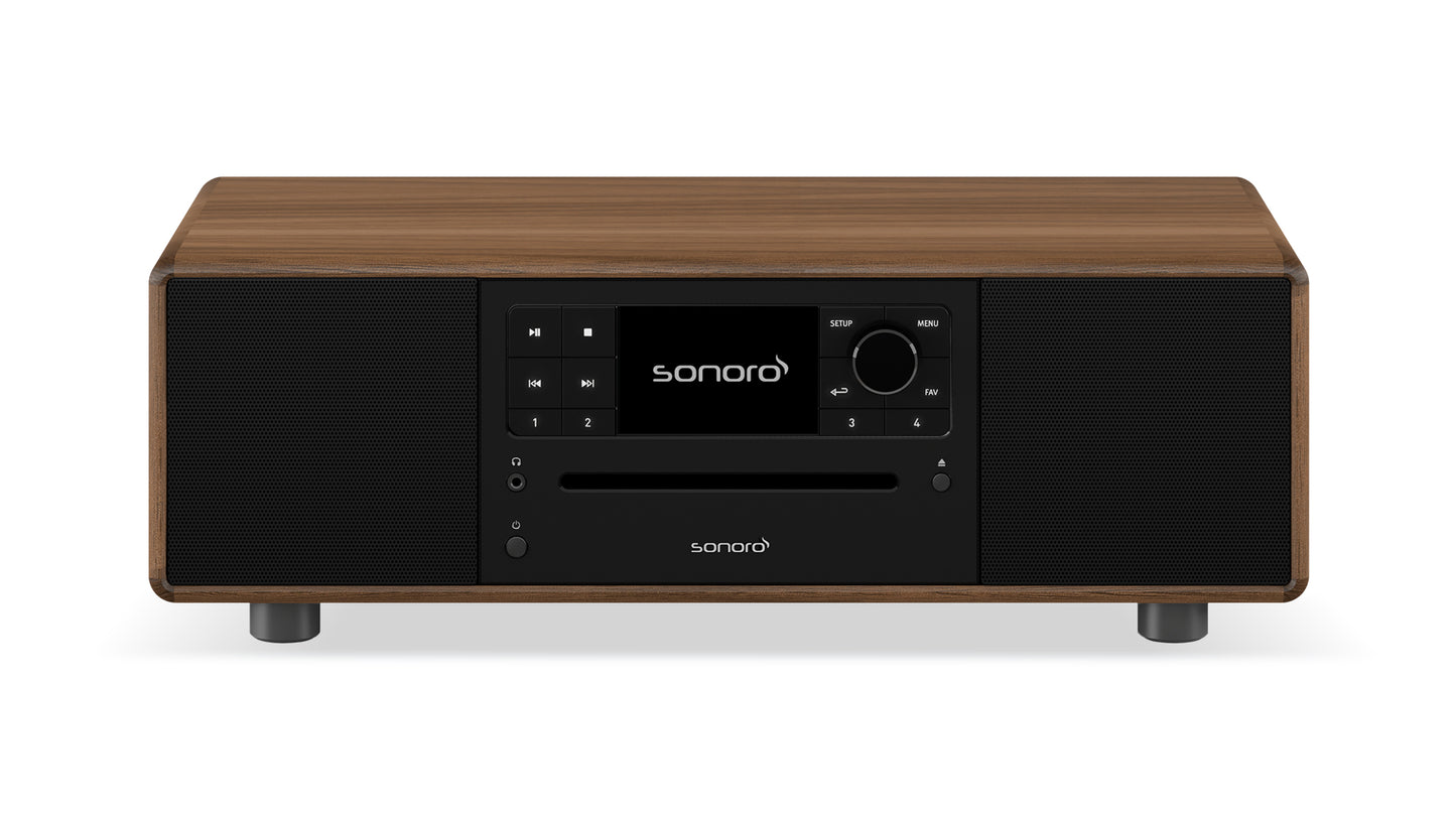Der Sonoro Prestige in Walnuss-Anthrazit verfügt über eine rechteckige Holzoberfläche, eine schwarze Frontplatte, ein digitales Display mit sonoro-Logo, einen CD-Einschub, Bedientasten und zwei Lautsprecher für exzellente Akustik.