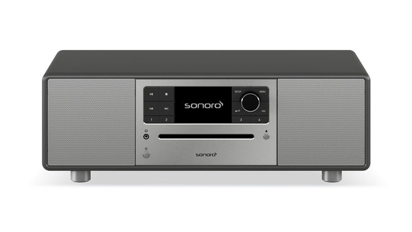 Der Sonoro Prestige in Graphit (matt) - Silber verfügt über ein zentrales Display, einen Bedienknopf, Tasten und einen CD-Schacht zwischen zwei Lautsprechern - perfekt für verschiedene Musikquellen und eine hervorragende Akustik in einem schlanken, modernen Design.