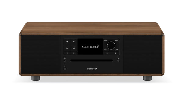 Der Sonoro Prestige in Walnuss-Anthrazit verfügt über eine rechteckige Holzoberfläche, eine schwarze Frontplatte, ein digitales Display mit sonoro-Logo, einen CD-Einschub, Bedientasten und zwei Lautsprecher für exzellente Akustik.